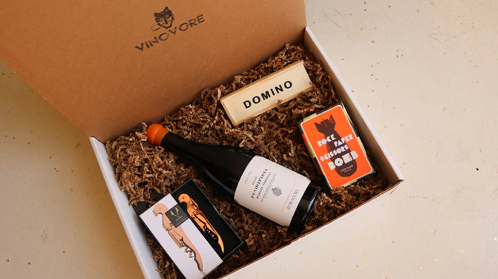 Vinovore gift box of wine, dominos, a card game and bottle opener