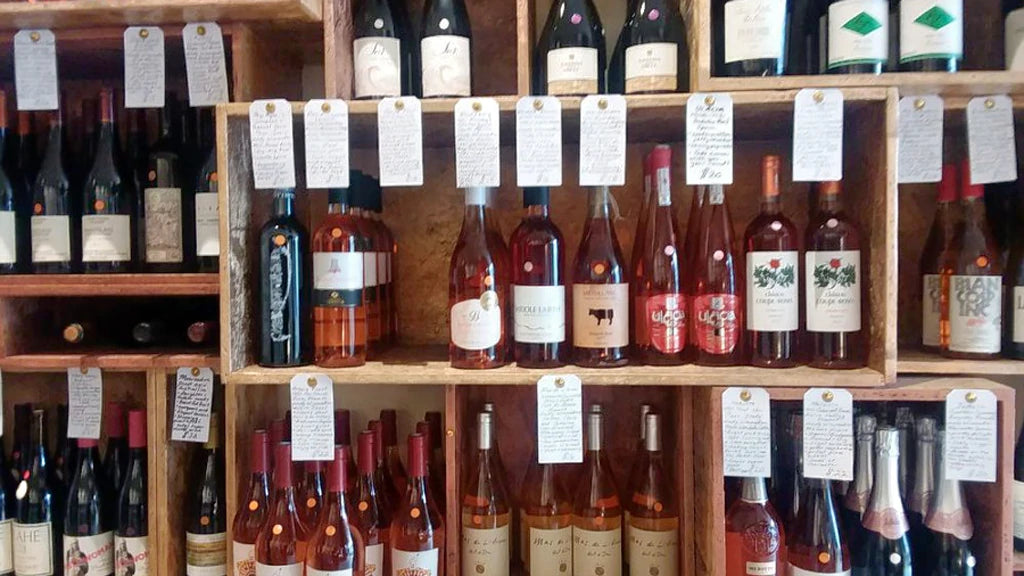 Wine bottles on shelves with wine tags