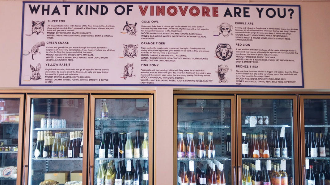 Signage in Vinovore Eagle Rock over a wall of cold cases filled with wine