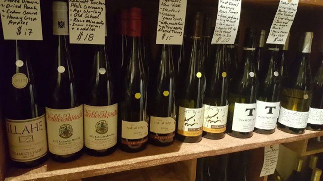 Close up on bottles on wine on a shelf