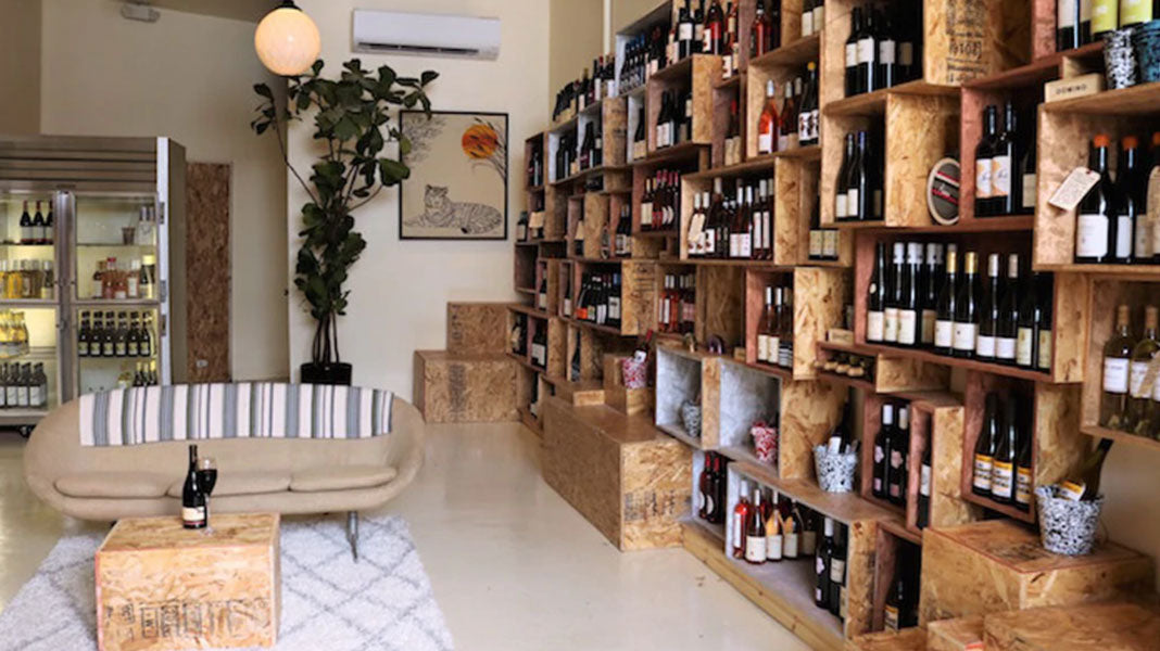 Wine bottles on the shelves at Vinovore
