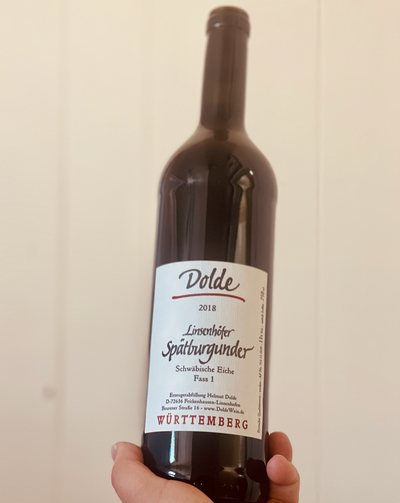 100% Spatburgunder Wuttemberg, Germany.  Woman winemaker - Hedwig Dolde. All natural. Chillable Red. Volcanic minerality. Whisper of red fruit and Alpine herbs. Smokey cherries. Smooth sultry jazz in a bottle. Wooden barn. Warm boozy forest vibes.