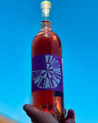 2 kinds of grapefruit, rosé of Pinot Noir and botanicals. Napa, California.  Woman winemaker - Samantha Sheehan. All natural. Bitter bomb like a jaded EX but in a good way. Tangy spark. Perfect on its own over ice to start the night or make it into a spritz of cocktail.