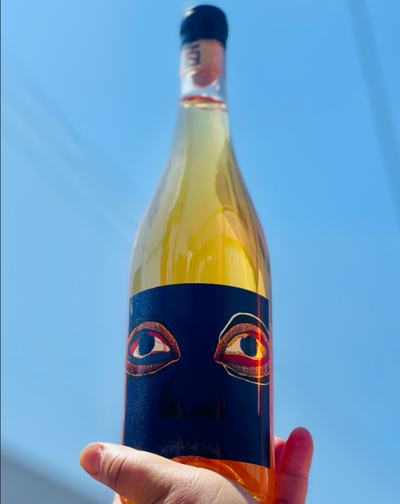 86% Chenin Blanc, 14% Viognier Swartland, South Africa.  Woman winemaker - Trizanne Barnard. Orange Wine. 1% for the planet + B Corp. Uniquely refreshing. Spiced chamomile tea. Tangerine zest. Apricot and honey. Album cover art of Indaba is, S. African Jazz band.