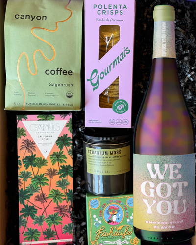 This box includes Canyon Coffee (choose your blend), Compartés California Love chocolate bar, Fishwife Smoked Rainbow Trout, a P.F. Candle (choose your scent) and a bottle of wine. You pick the color, and we'll include a bottle to complement this box.