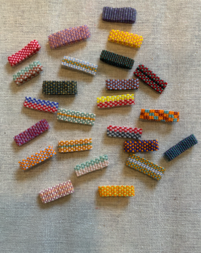 Assorted checkered beaded rings.