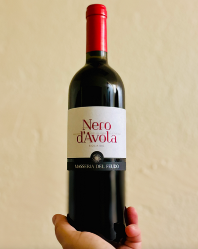 100% Nero d'Avola Sicily, Italy  Lady winemaker - Carolina Cucuvullo All natural. Chillable red. Total people pleaser and party starter.  Loads of dusty bramble and ripe blackberry lust. Mediterranean cherry. Bit of black olive. Juicy rich and crisp brightness. Dancing plum fairies.