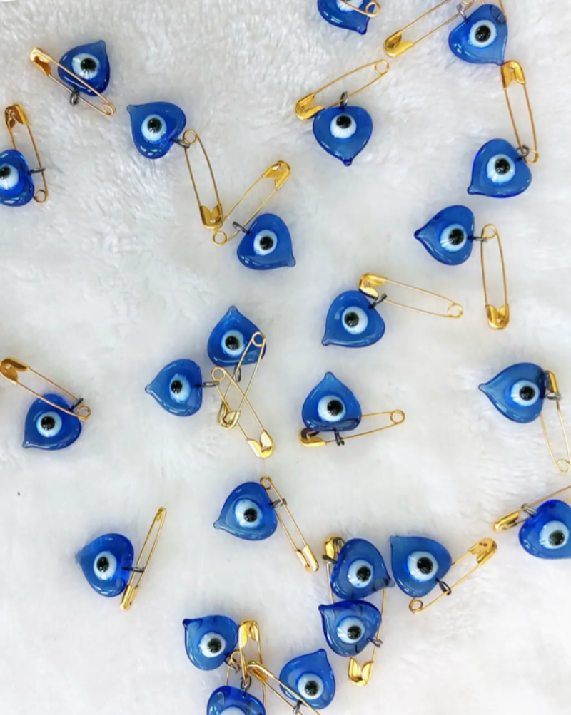 Hand blown glass Evil Eye with safety pin.