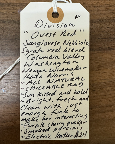 Sangiovese, Nebbiolo and Syrah red blend. Columbia Valley, Washington.  Woman winemaker - Kate Norris. All natural. Chillable red. Sun kissed and bold. Bright, fresh and clean with just enough funk to make her interesting. Purple cherry pucker. Smoked porcini. Electric leather.
