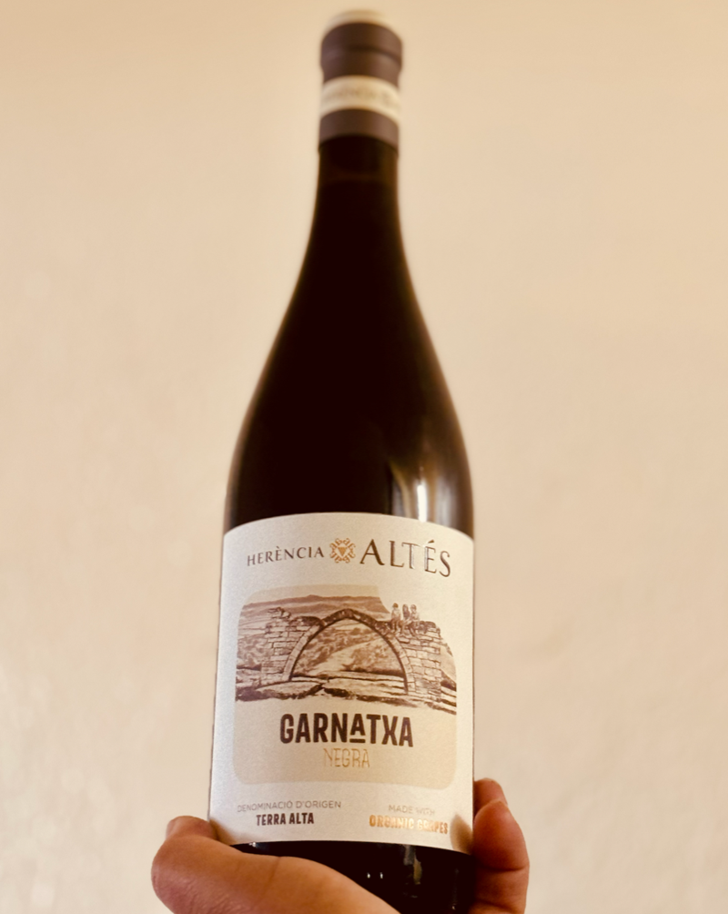100% Garnaxta. Catalonia, Spain.  Woman winemaker - Nuria Altes. All natural. Jumpy and fresh ripe red berries on the front yet a firm and pleasant grip on the back like a reverse mullet. Concentrated texture. Cherries and violets. Spiced citrus peels and roasted herbs. Licorice berry compote.