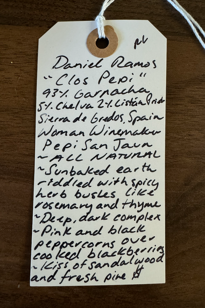 93% Garnacha, 5% Chelva, 2% Listán Prieto. Sierra de Gredos, Spain   Woman winemaker - Pepi San Juan. All natural. Sunbaked earth riddled with spicy herb bushes like rosemary and thyme. Deep dark and complex like a black and white art film. Pink and black peppercorns over cooked blackberries. Kiss of sandalwood and fresh pine.
