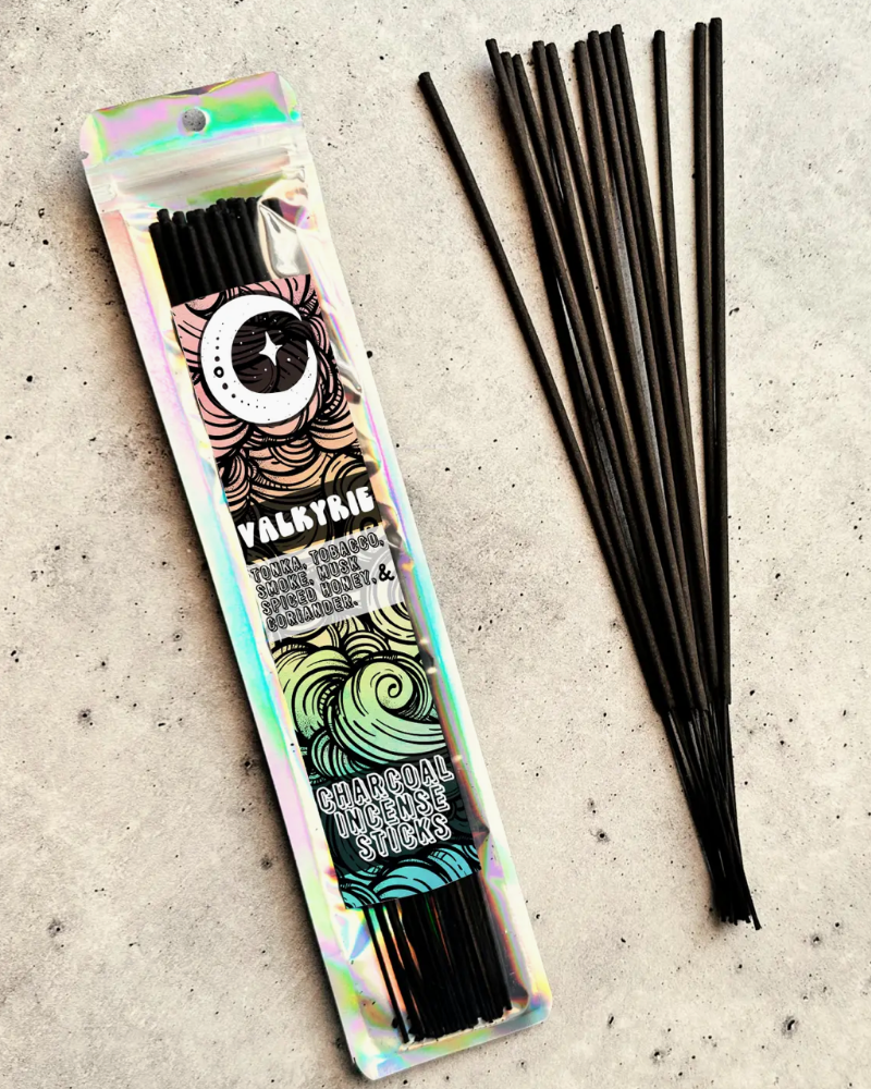 Valaryrie charcoal incense sticks with packaging on a textured surface