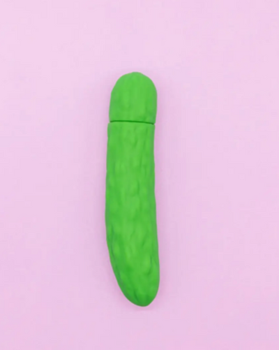 Green cylindrical object on a light purple background