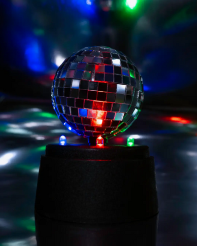 Discoball with colorful lights on a dark background