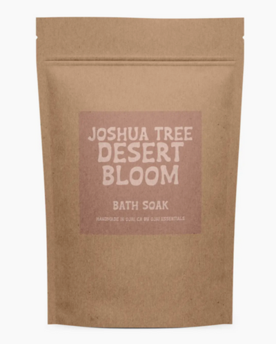 Brown paper bag with 'Joshua Tree Desert Bloom Bath Soak' text on a white background