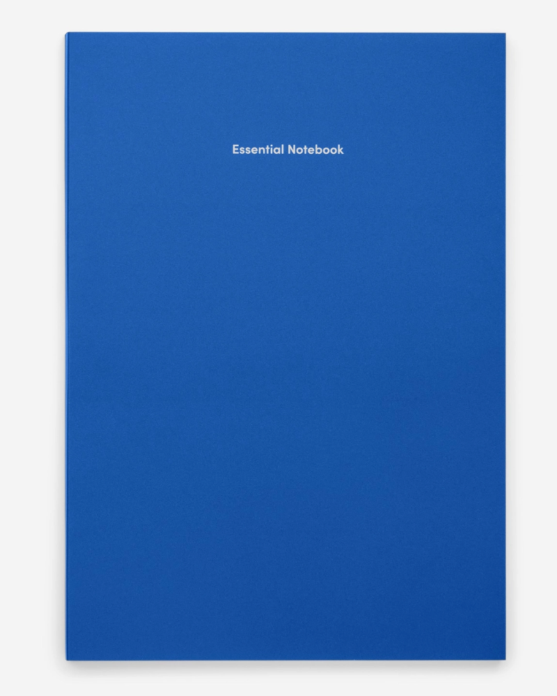 Blue notebook with 'Essential Notebook' text on a white background