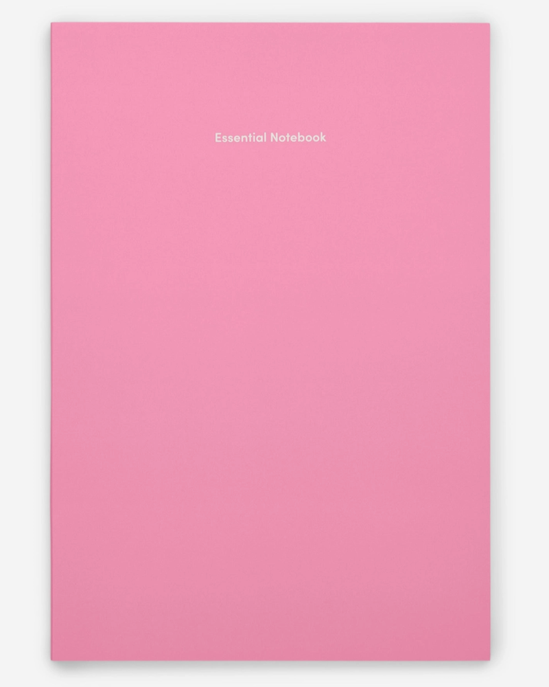 Pink notebook with 'Essential Notebook' text on a white background