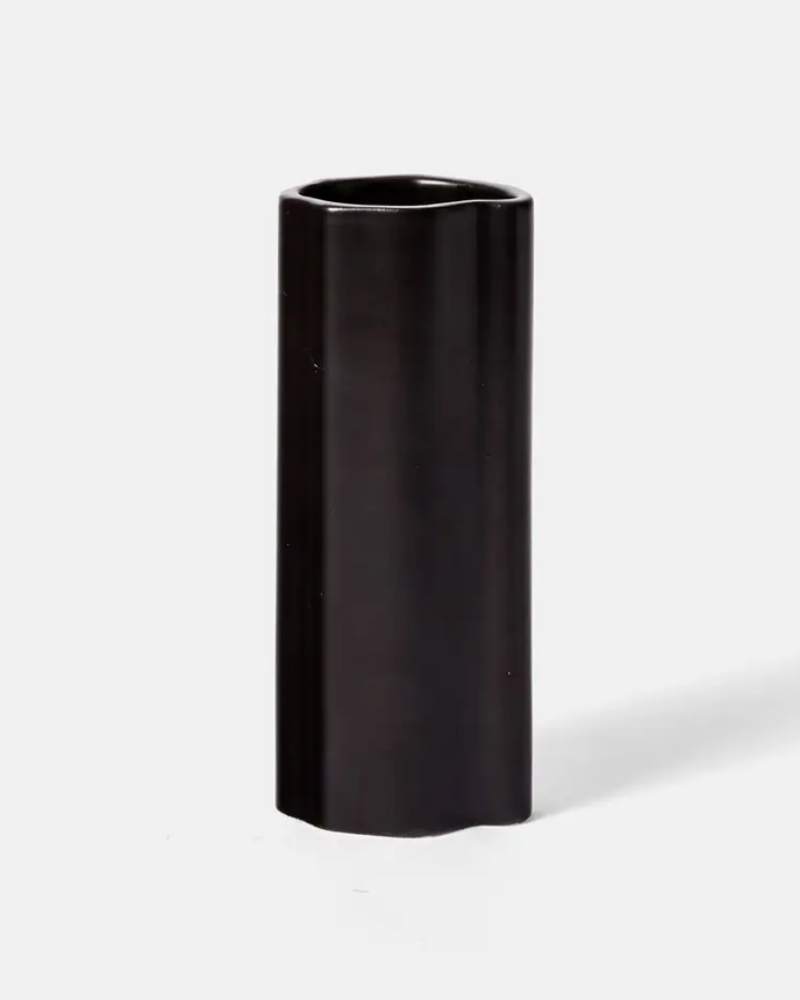 Black cylindrical vase on a white background