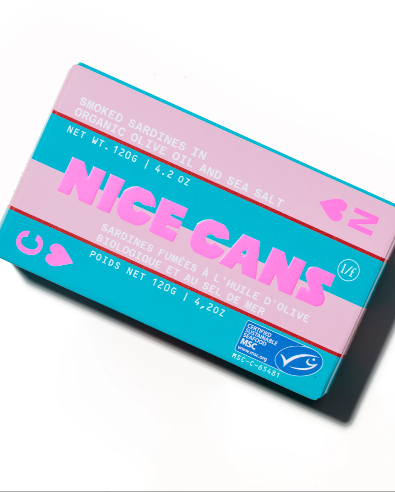 Packaging of Nice Cans with pink and blue design on a white background