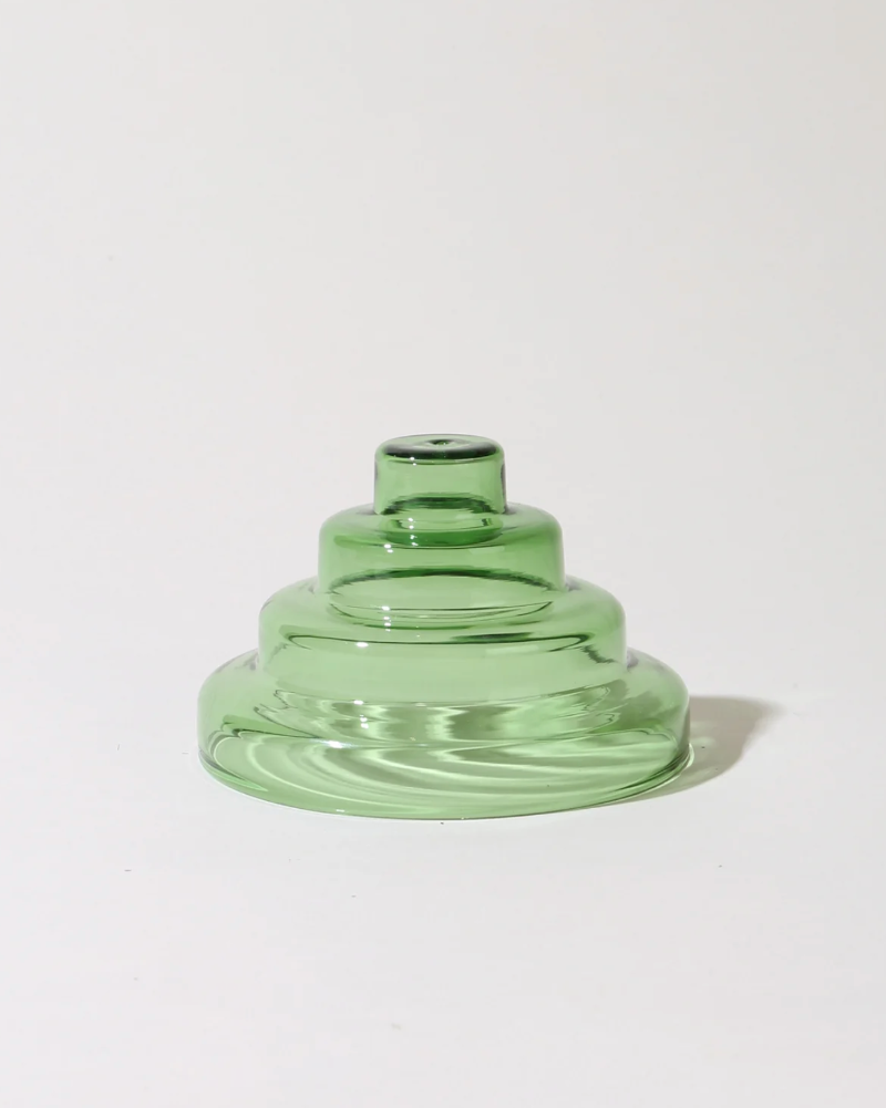 Green glass vase on a white background