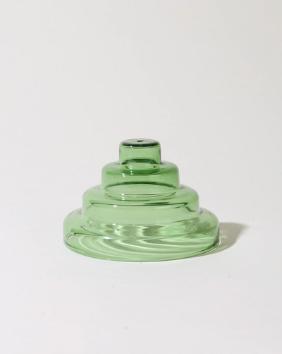 Green glass vase on a white background