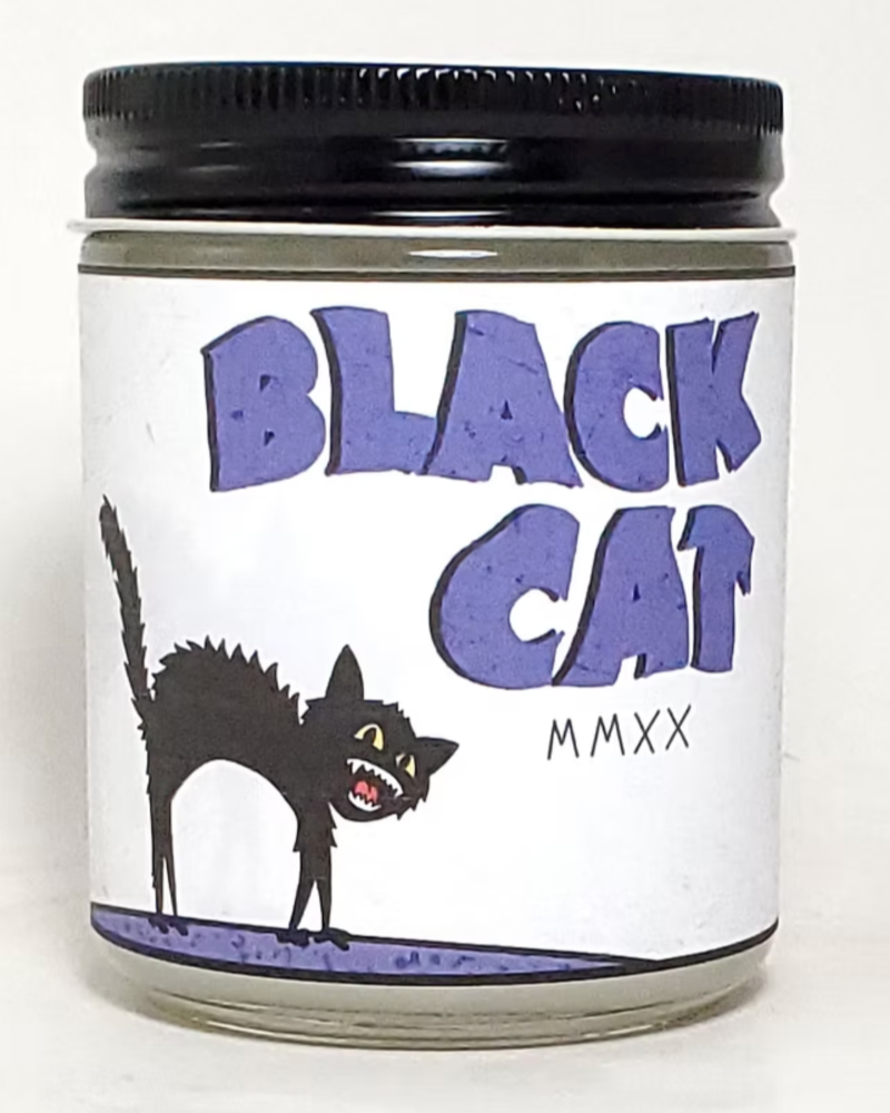 Candle jar with 'Black Cat' label and black lid on a white background