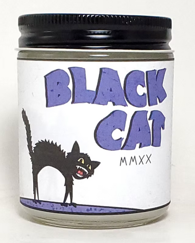 Candle jar with 'Black Cat' label and black lid on a white background