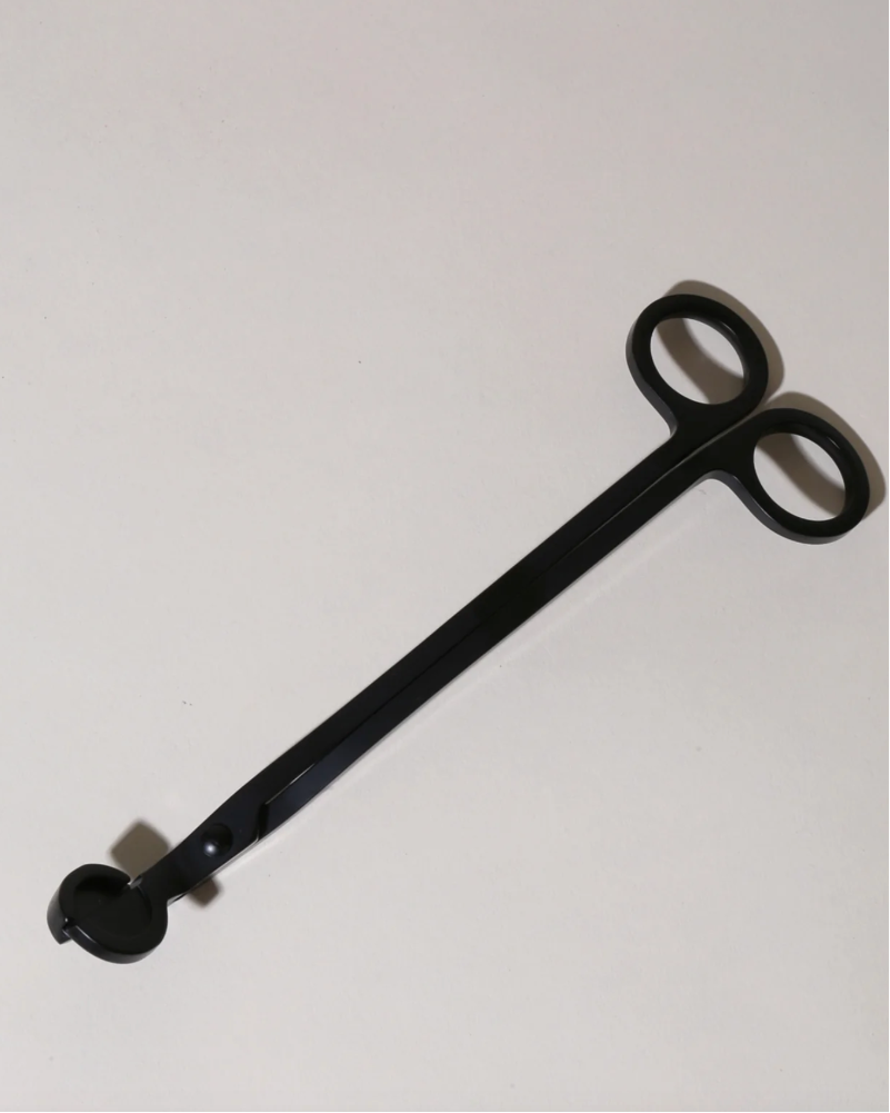 Black metal snipper with circular ends on a white background