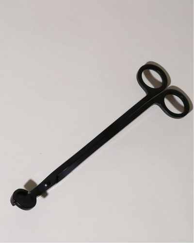 Black metal snipper with circular ends on a white background