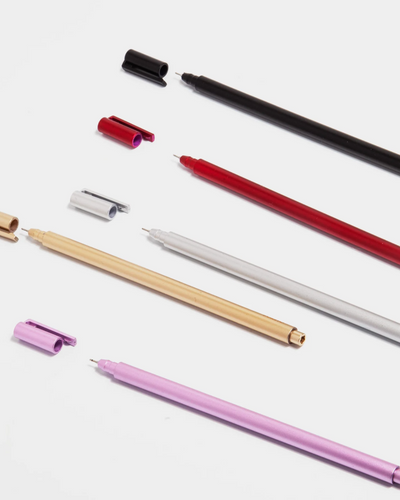 Set of colorful pens on a white background