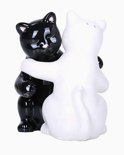 Ceramic with rubber stoppers and magnetic kissing.
