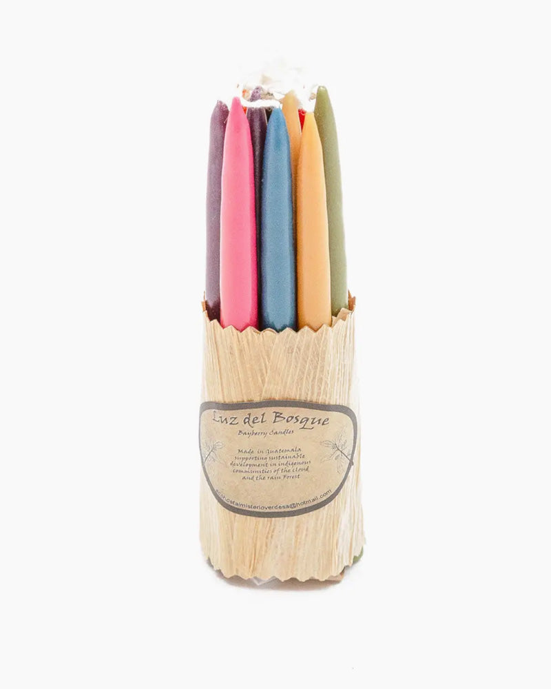 Hand-dipped candles (which come in a set of 10) are made by the Q'eqchi people of the Guatemalan cloud forests using natural Myrtle wax. Each small candle burns for approximately 1.5 hours, comes in assorted colors, and smells faintly of bayberry.