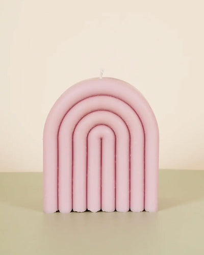 Our handcrafted arches feature a retro-inspired design, updated with a modern color palette.

10 ounces Hand-molded Soft blush pink&nbsp;
100% American-grown soy wax
Un-scented
Burn time up to 30 hours
Measures approx. 3 inches x 2.25 inches x 3.5 inches

Woman owned