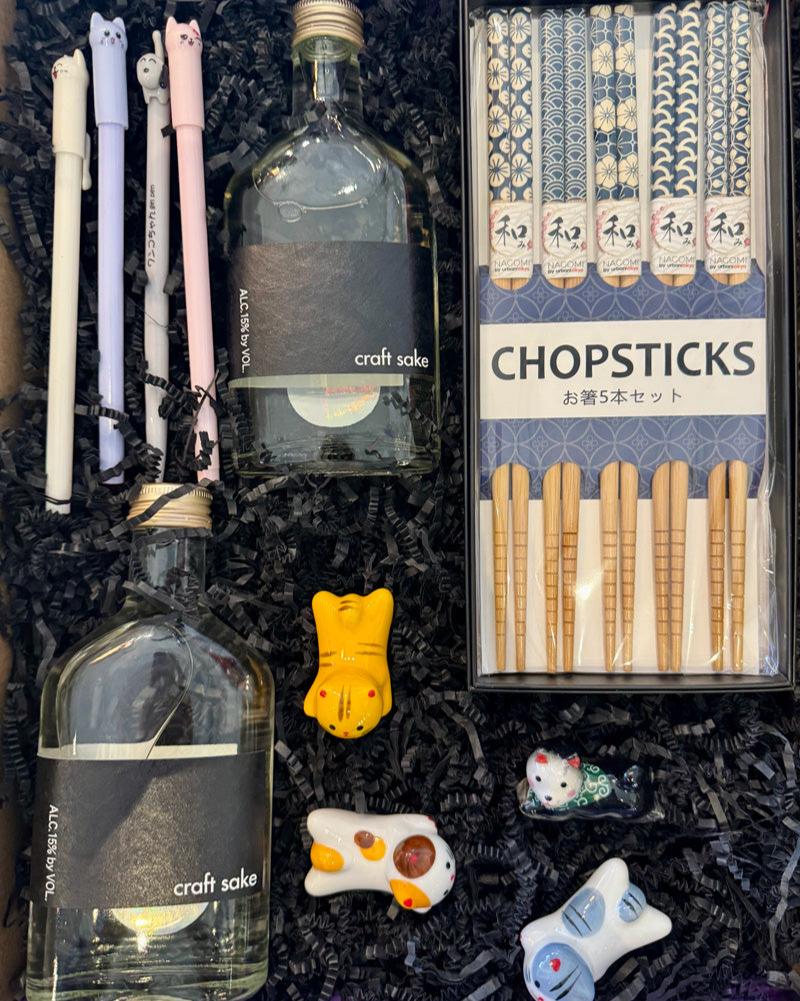 Our Sake To Me Box includes:

2 bottles of Craft Sake, 4 gel pens (assorted), 4 Porcelain Pet Chopsticks Rests (assorted), 5-piece Chopsticks set.

*Substitutions of similar items may be made if products shown in this box are sold out at the time of ordering.