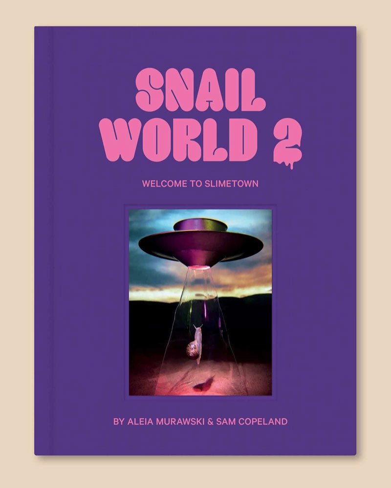 In this 160-page, supersized sequel to their cult favorite coffee table book Snail World, artists Aleia Murawski and Sam Copeland meticulously craft miniature scenes and bring them to life with real snails. Look closely at these mesmerizing photos, and you might find that beneath its ordinary surface, there’s more to Slimetown—if you’re willing to follow the trail of slime.