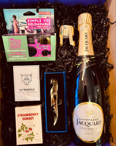 Our Tonight's The Night Box includes:

Jacquart Mosaique Brut, reloadable camera, Werewolf card game, Strawberry Sunset card came, stopper and opener.

*Substitutions of similar items may be made if products shown in this box are sold out at the time of ordering.