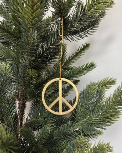 Artisan-crafted ornament made from hand-cut and hammered brass sheet. Ready to hang.