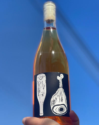 100% Riesling Snake River, Idaho.  Woman winemaker - Laura Hefner-Glavin. All natural. Orange wine. Dried apricot, coconut and cashew trail mix. A stroll down a wet sidewalk in Spring through Funky Fruit Awesome Town! A little bit country a little bit rock 'n roll! Hambone Dry!