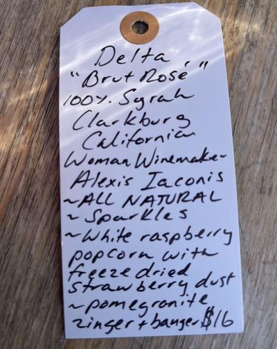100% Syrah Clarkburg, California.  Woman winemaker - Alexis Iaconis. All natural. Sparkles. White raspberry popcorn with freeze dried strawberry dust. Pomegranate zinger + banger.