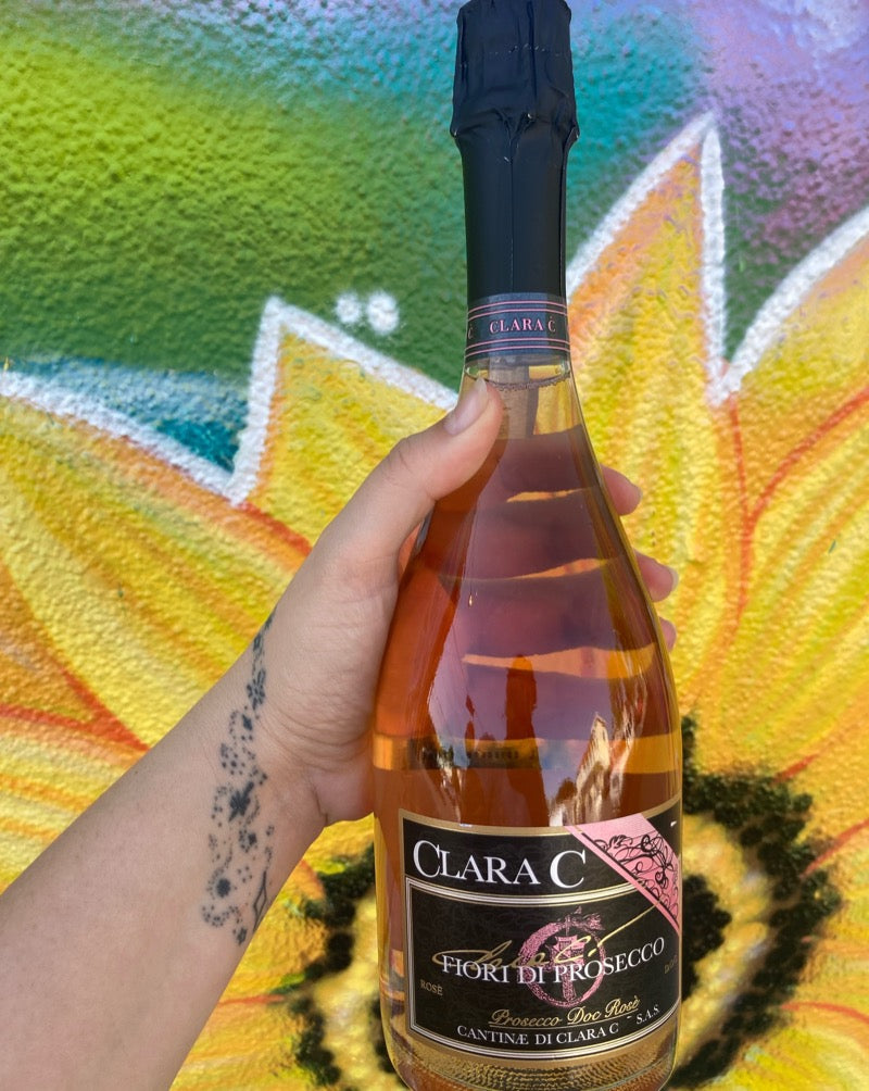 100% Pinot Noir Veneto, Italy.  Woman winemaker - Clara Carpene. All natural. Wow Dry factor! Delicate bubbles. Femme on the streets butch on the streets. Lovely and dirty. Peach biscuit. Tart crispness. Strawberry tickle.