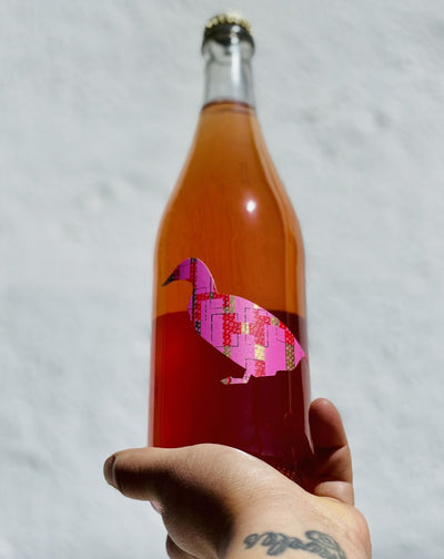 95% Fennão Pirces. 5% Baga. Bairrada, Portugal.  Woman winemaker - Maria Pato. All natural. Pét-nat (bubbles). Cranberry crusher. Fluorescent peaches. Day 2 - Bananas! Roses + mango. A fizzy stroll on a tropical island.
