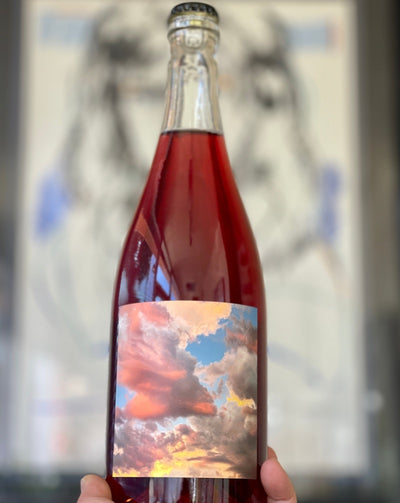 Carbonic Co-Ferment of Syrah + Chenin Blanc + a bit of Skin contact Riesling and Pinot Meunier Santa Barbara, California.  Woman winemaker - Emilie Towe. All natural. Red and white blend. Fanciful Wonka-style, super limited yumminess. Crackling cranberry. Rugged good looks. Wild Fizz.