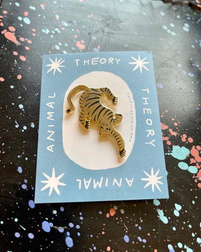 Embossed and enamel gold pin. Rubber backing.  Women owned and local!