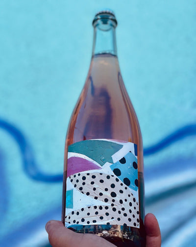 100% Gamay Portland, Oregon.  Woman winemaker - Kate Norris. All natural. Pét-Nat (bubbles). Juicy and spritz. Strawberry pop tart. Dry and lovely. Bubbly pink rainstorm with saline mineral lightning bolts.