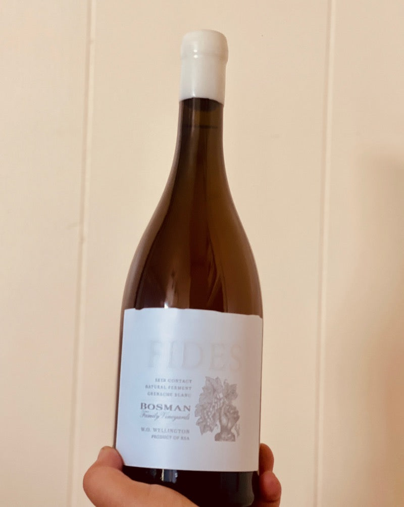 100% Grenache Blanc West Cape, South Africa.  Woman winemaker - Natasha Williams. Black female winemaker in South Africa. Orange wine Sticky marzipan. So tasty and savory you will want to lick the glass after. Honeyed but dry. White freesias. Toasted orange zest.