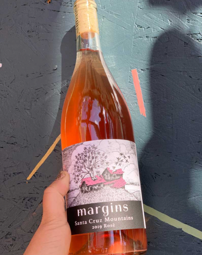 53% Merlot, 47 % Barbera Central Coast, California.  Woman winemaker - Megan Bell. All natural. Pink grapefruit. Mineral race car driver in a sexy watermelon car doing donuts in gravel.
