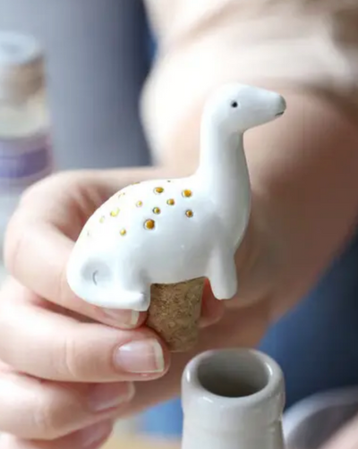 Cutie dinosaur bottle stopper. Resin with painted finish. Cork stopper.