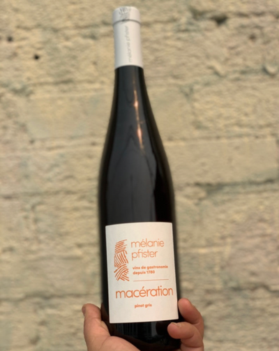 100% Pinot Gris Alsace, France.  Woman winemaker - Mélanie Pfister. All natural. Orange wine. 15 days on skins. Yellow cherries. Rhubarb + sage. Apricots + peach sunsets on a nude beach. Wild strawberries.