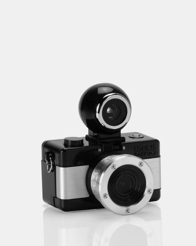 With a sleek black metallic design, the oh-so-adorable Fisheye Baby 110 Camera may be small, but it packs a 170-degree punch, shooting super-cool bulbous spheres on 110 film.