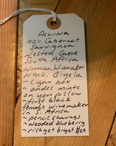 100% Cabernet Sauvignon Western Cape, South Africa.  Woman winemaker - Ntsiki Biyela. The first black female winemaker in South Africa. Cigar box. Andes mints on your pillow. Pencil shavings. Wooded blueberry. Rich yet bright.